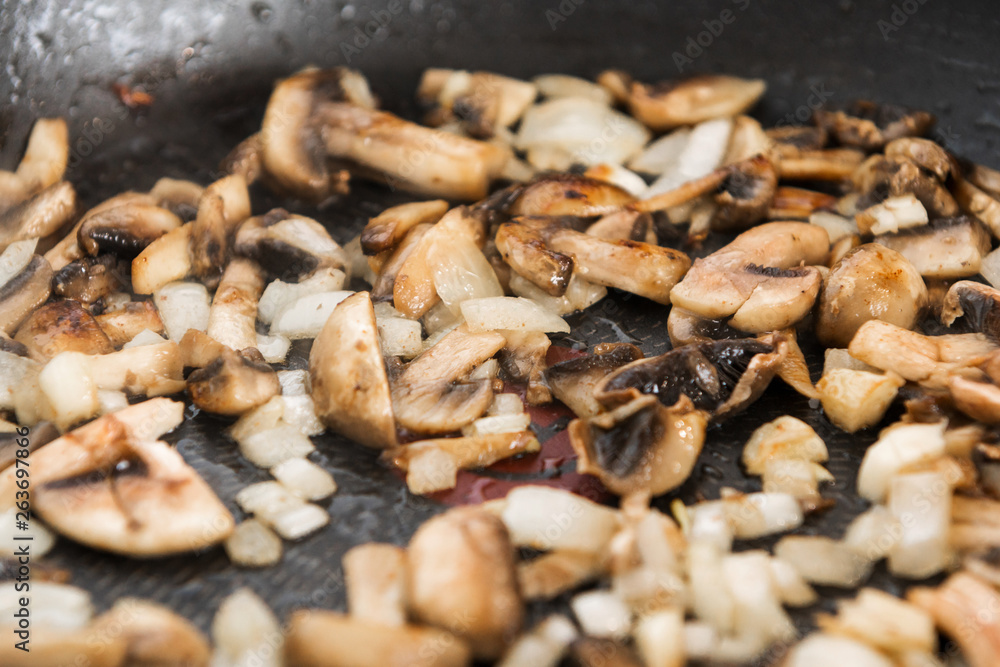 Fried mushrooms in a pan food ingredient Fried mushrooms in a pan food ingredient