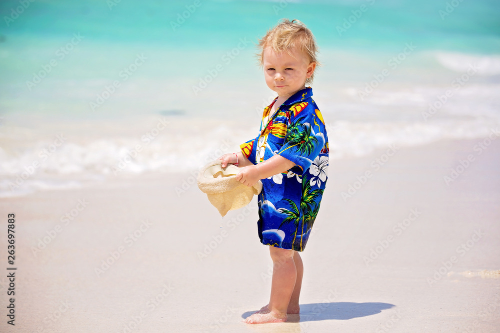 Adorable toddler boy in summer holiday resort in Mauritius, casually dressed Adorable toddler boy in summer holiday resort in Mauritius, casually dressed