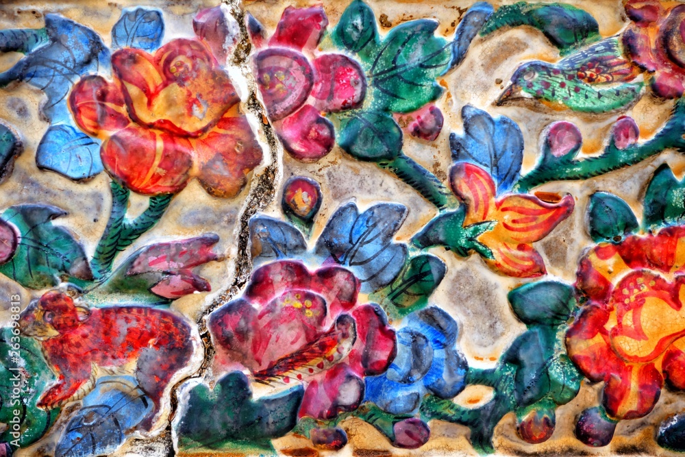 Fototapeta premium Vintage Thai Sculpture on Stone Wall.