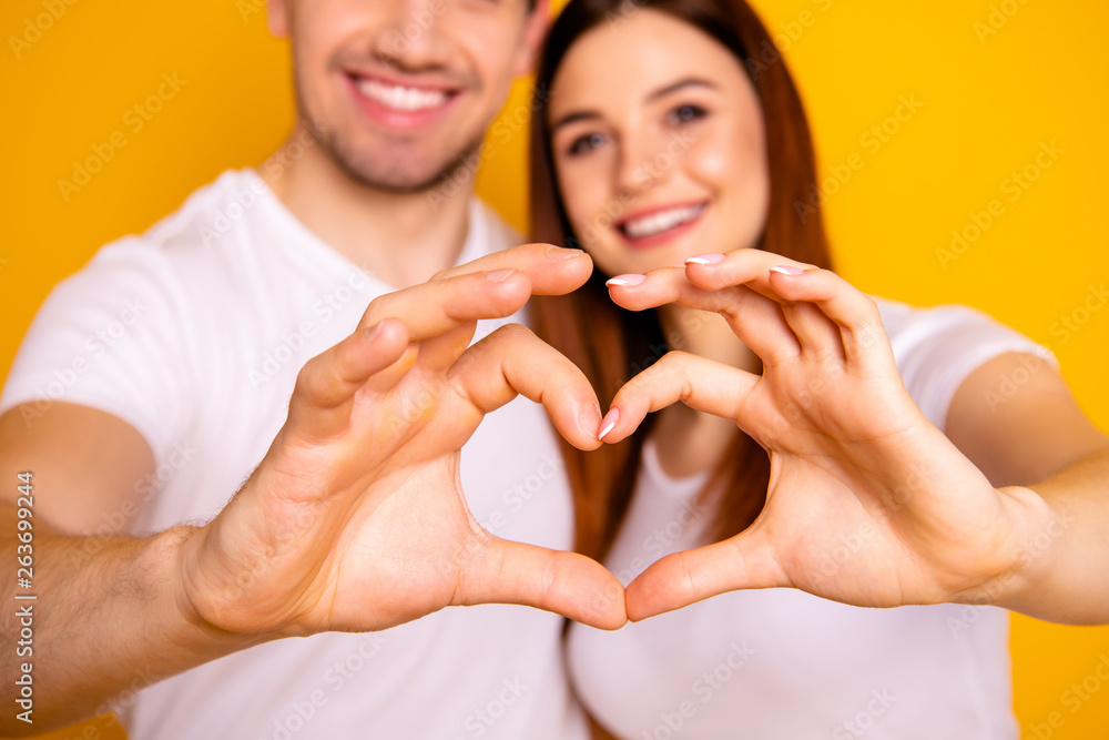 Cropped close up photo amazing beautiful she her he him his guy lady arms fingers make heart figure form romance mood hugging sincere wear casual white t-shirts outfit isolated yellow background Cropped close up photo amazing beautiful she her he him his guy lady arms fingers make heart figure form romance mood hugging sincere wear casual white t-shirts outfit isolated yellow background