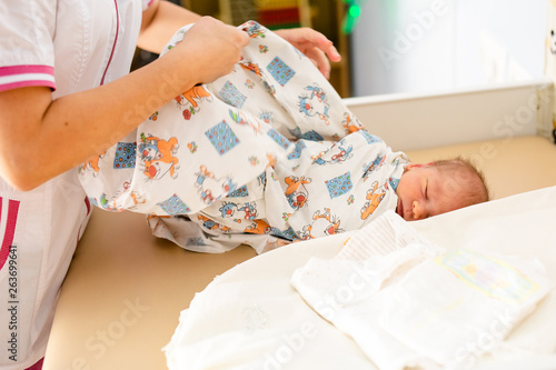 Newborn baby. Little child in medicine hospital. Medical health care. Doctor pediatrician. Small kid, infant in clinic