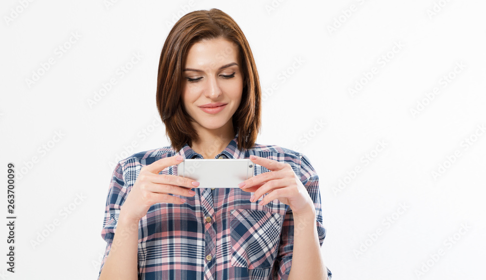 Woman using and reading watching a smart phone. Girl watching video on cellular. Woman using and reading watching a smart phone. Girl watching video on cellular.