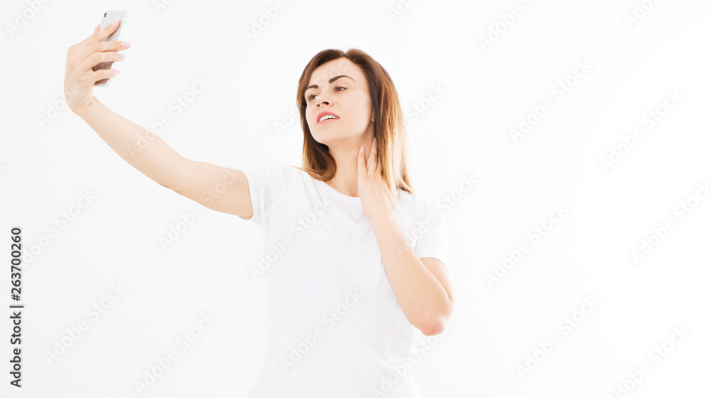 Pretty young happy woman making selfie on smartphone and touches his neck over white Pretty young happy woman making selfie on smartphone and touches his neck over white