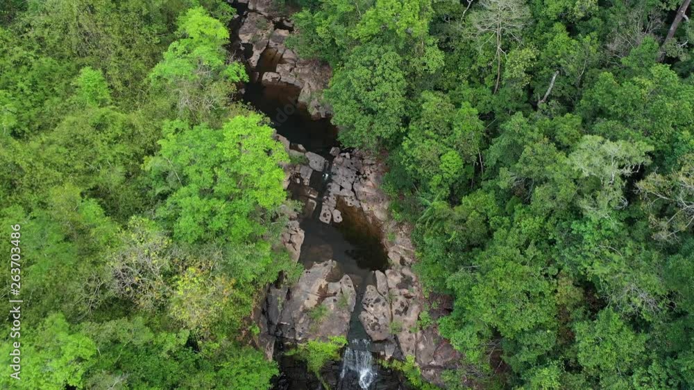 Aerial view. waterfall in deep forest. Khlong Chao Waterfall in Koh Kood, Thailand Aerial view. waterfall in deep forest. Khlong Chao Waterfall in Koh Kood, Thailand
