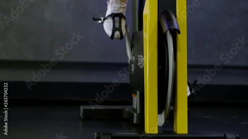 Wallpaper Mural Legs that pedal on a stationary bike close-up. Torontodigital.ca