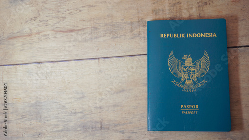 Top view of indonesian passport on wooden desktop - Image