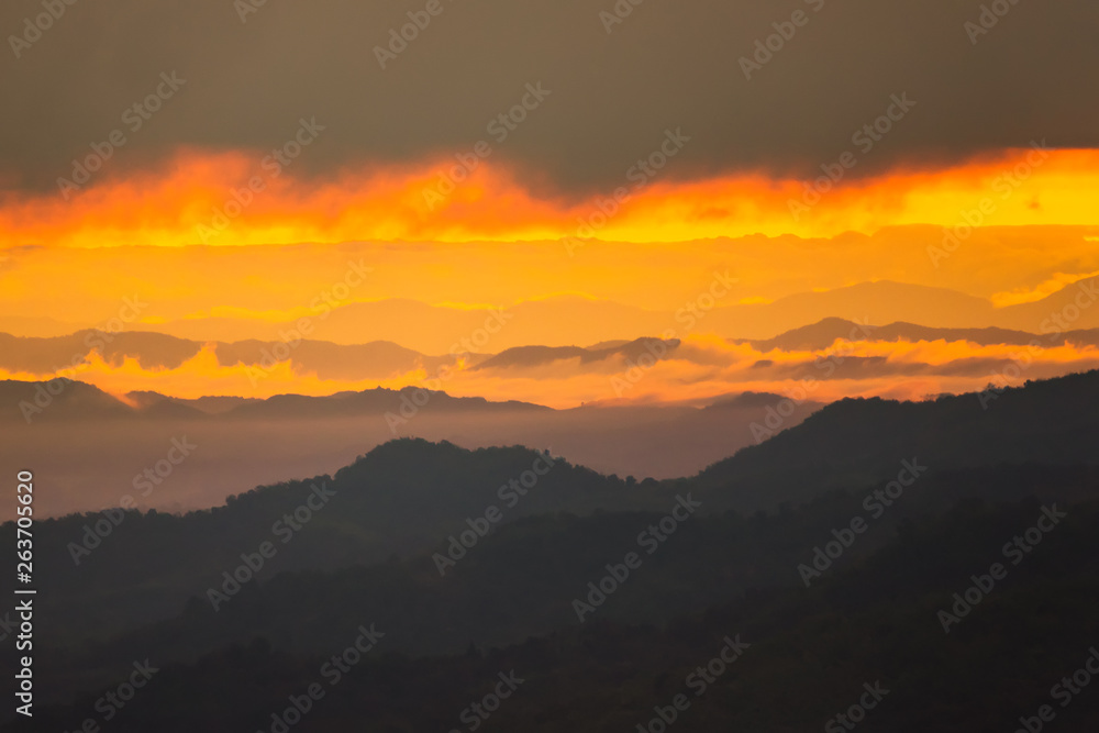 Sunrise.Mountain valley during sunrise. Natural summer landscape.Lighting before sunrise at the morning time.Thailand.