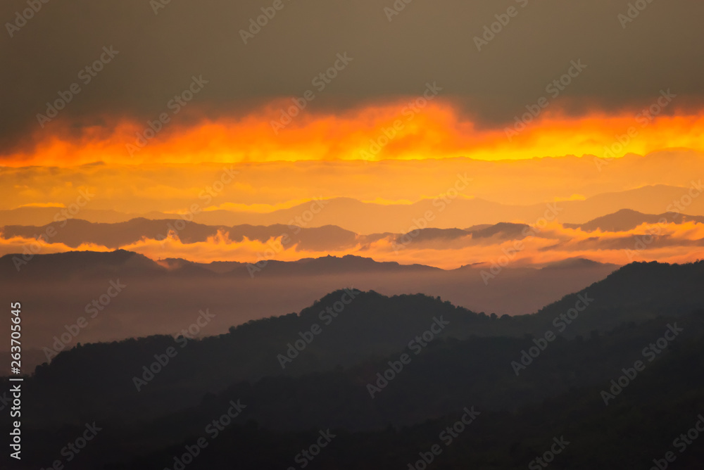 Sunrise.Mountain valley during sunrise. Natural summer landscape.Lighting before sunrise at the morning time.Thailand.