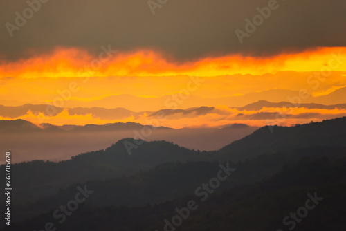 Sunrise.Mountain valley during sunrise. Natural summer landscape.Lighting before sunrise at the morning time.Thailand. © bubbers