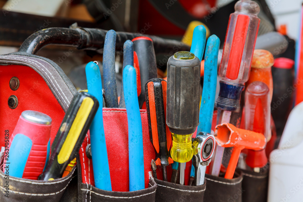 tools in bag labor day and business fight crafting tools on a work table. tools in bag labor day and business fight crafting tools on a work table.