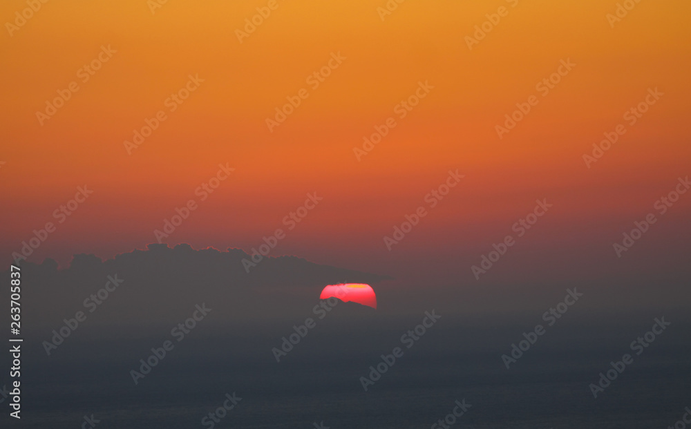 Natural Sunset Orange Sunrise Over Field Or Meadow. Bright Sky And Dark Ground.