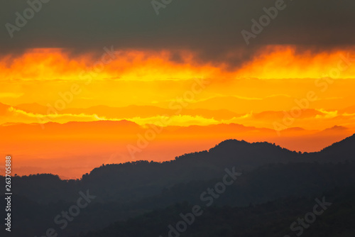 Sunrise.Mountain valley during sunrise. Natural summer landscape.Lighting before sunrise at the morning time.Thailand.