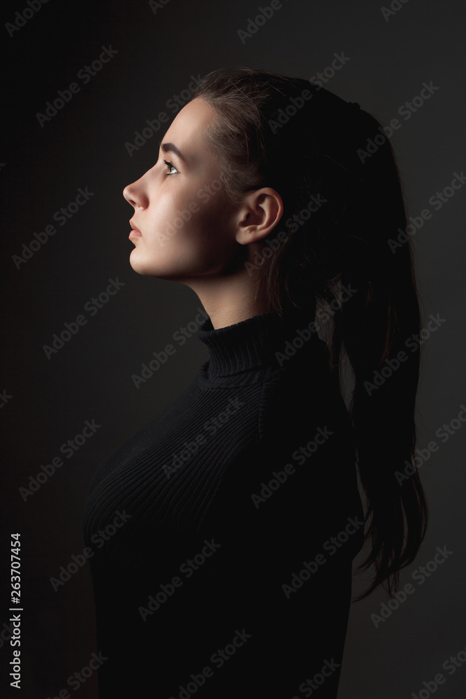 Beautiful girl in profile. Low key Beautiful girl in profile. Low key