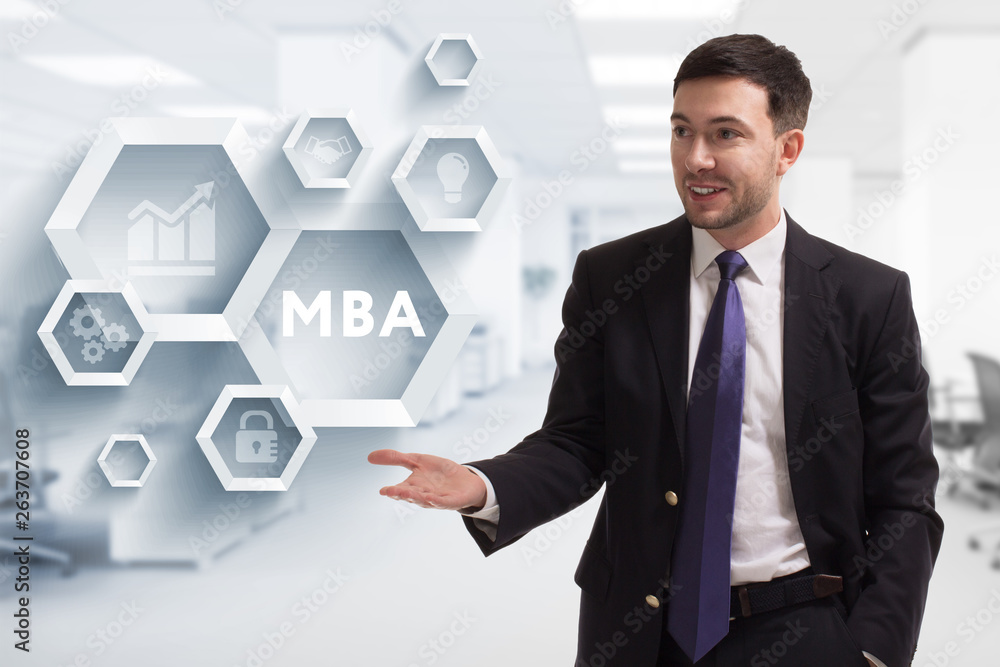 The concept of business, technology, the Internet and the network. A young entrepreneur working on a virtual screen of the future and sees the inscription: MBA The concept of business, technology, the Internet and the network. A young entrepreneur working on a virtual screen of the future and sees the inscription: MBA
