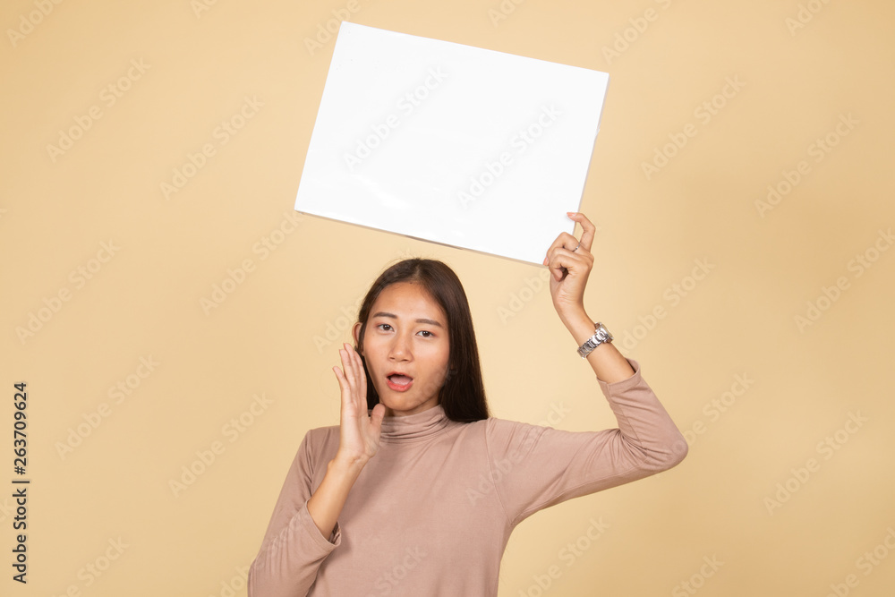 Young Asian woman surprise with white blank sign. Young Asian woman surprise with white blank sign.