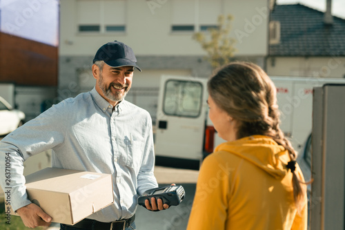 Express courier delivering a box