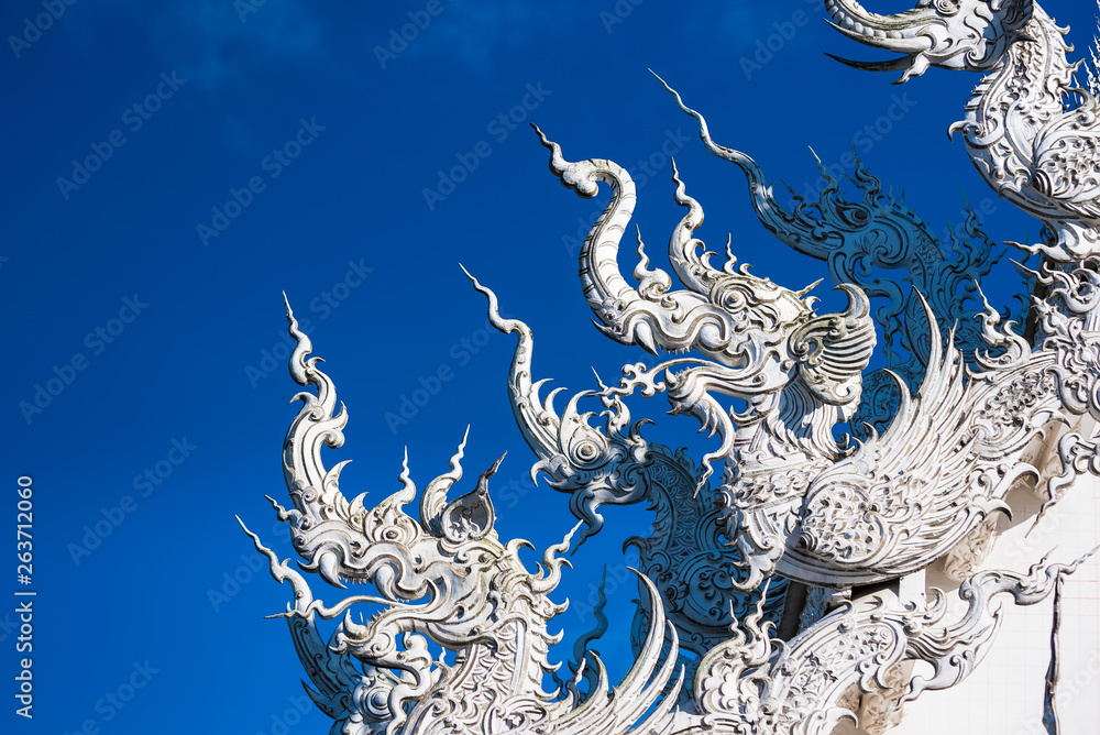Decoration on top of roof at Wat Rong Khun Chiang Rai province Thailand.