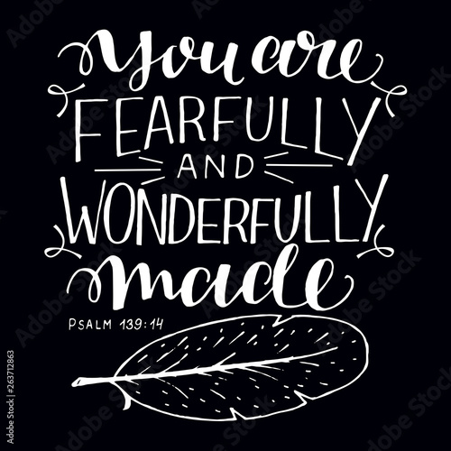 Hand lettering with bible verse You are fearfully and wonderfully made on black background.