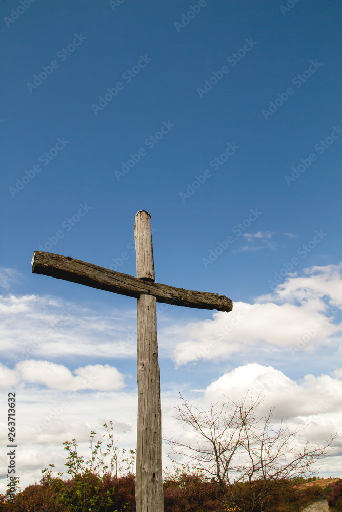 Old wooden cross in Camino de Santiago Old wooden cross in Camino de Santiago