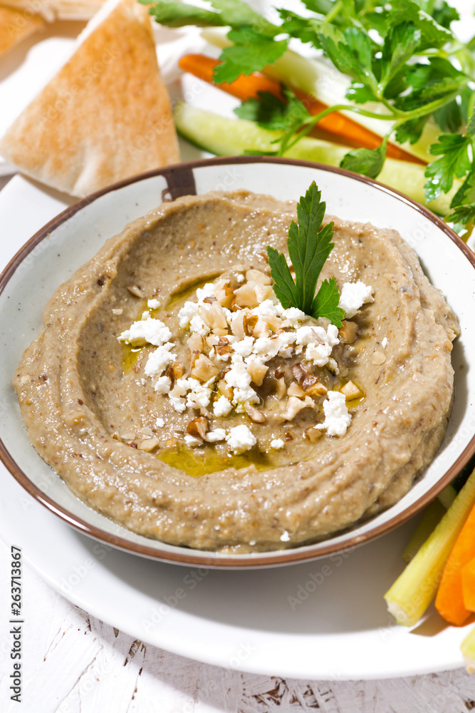mediterranean appetizer - hummus and fresh vegetables, vertical top view mediterranean appetizer - hummus and fresh vegetables, vertical top view