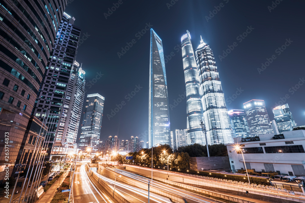 Fototapeta premium Road City Nightscape Architecture and Fuzzy Car Lights..