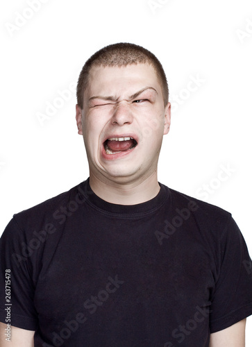 Disgust face with open mouth. Portrait of young man. Facial expression.
