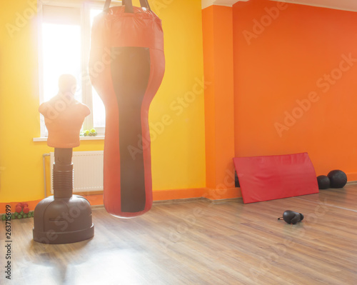 Modern boxing room with sun in the window, copy space, orange, dummy