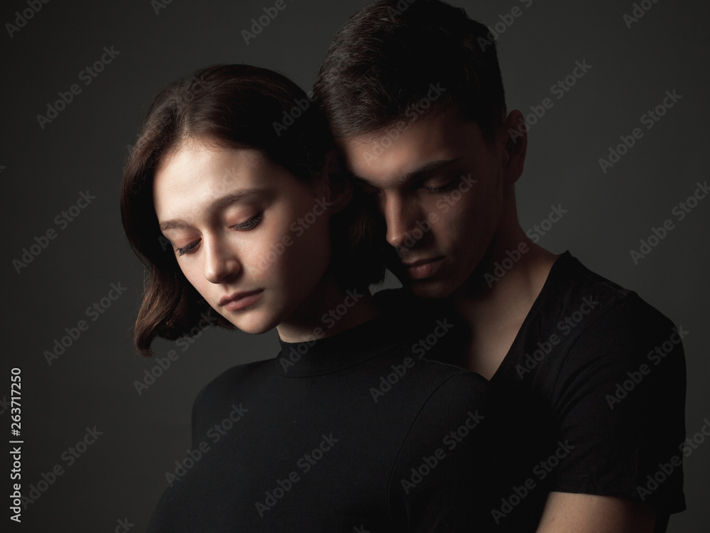 Young woman and young man in studio. Young woman and young man in studio.