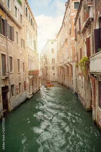Boat in canal waters of Venice Italy. Water steet in Europe