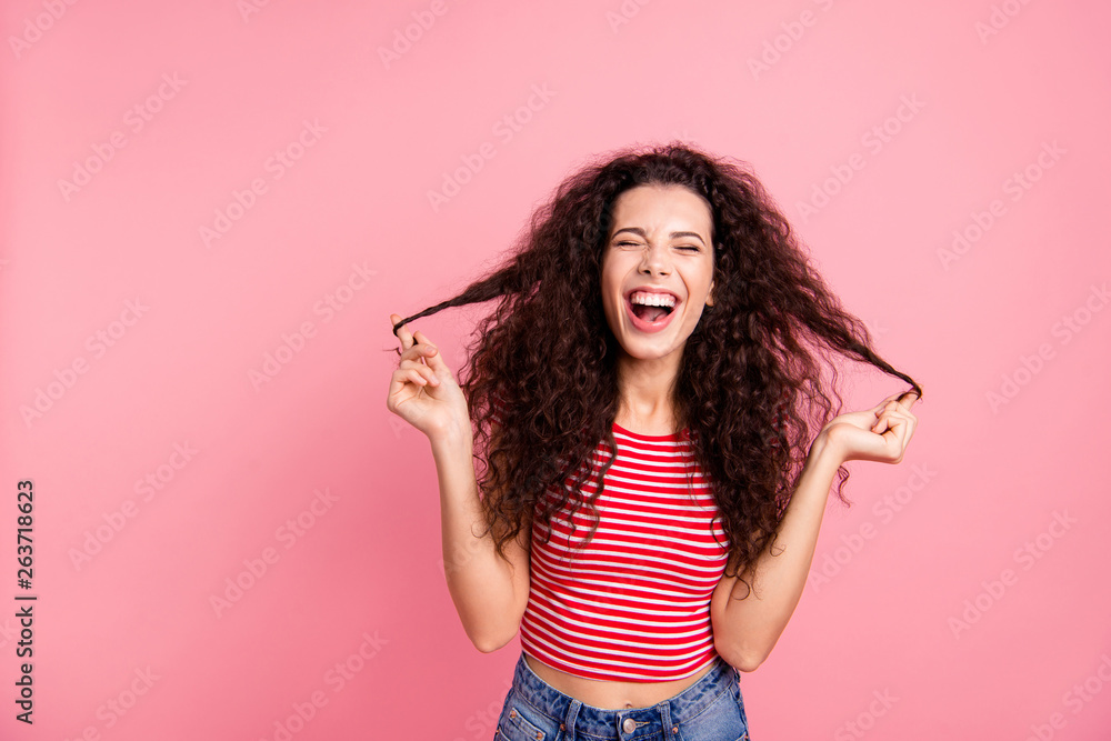 Closeup photo portrait of positive pretty glad optimistic cheerful joking grimacing she her lady holding curls in hands isolated pastel pop background Closeup photo portrait of positive pretty glad optimistic cheerful joking grimacing she her lady holding curls in hands isolated pastel pop background