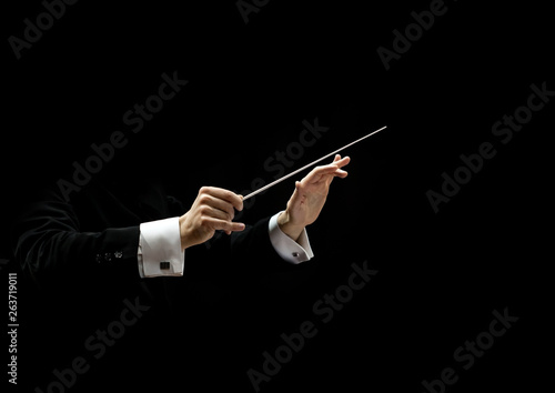 Photographie Hands of conductor on a black background