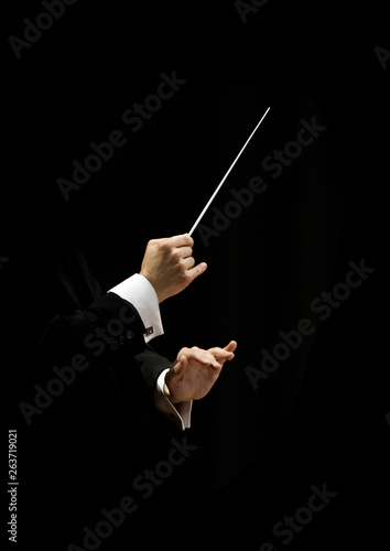 Hands of conductor on a black background