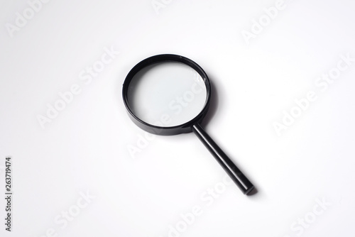 Office tools , Magnifying glass on white background