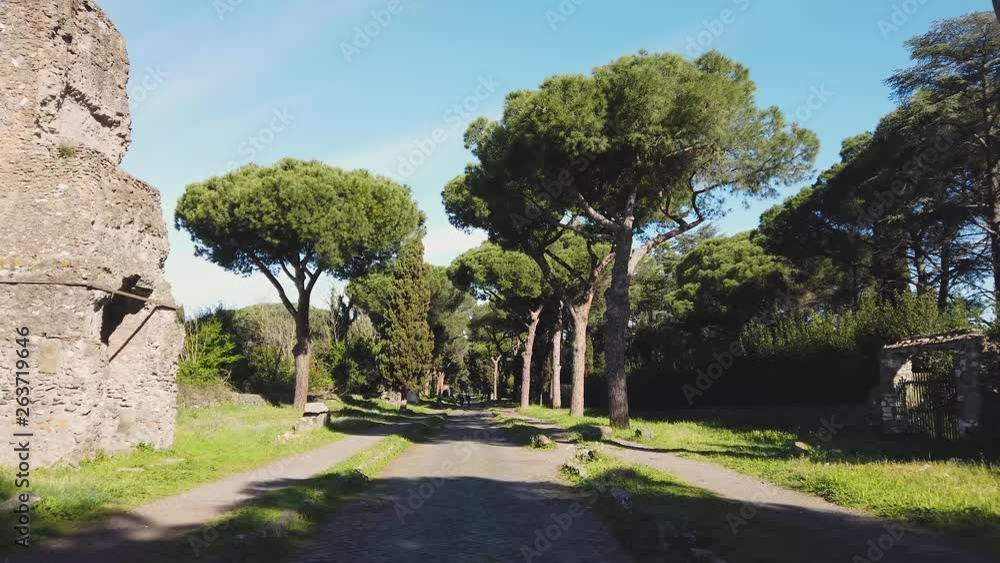 The ancient Appian Way (Appia Antica) in Rome on a sunny morning. The ancient Appian Way (Appia Antica) in Rome on a sunny morning.