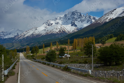 The Carretera Austral; famous road connecting remote towns and villages in northern Patagonia, Chile. Paved section of road running past snow capped mountains near the small town of Cerro Castillo.