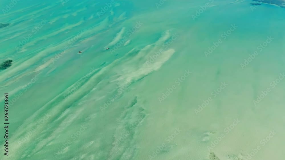 Aerial: Incredible Seascape with Two Men Kayaking in Porto de Galinhas, Brazil Aerial: Incredible Seascape with Two Men Kayaking in Porto de Galinhas, Brazil