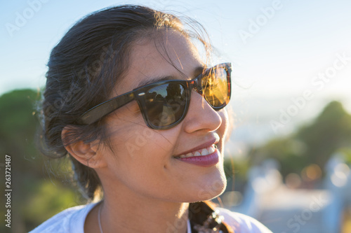 Young indian woman laughing and happy in the countryside