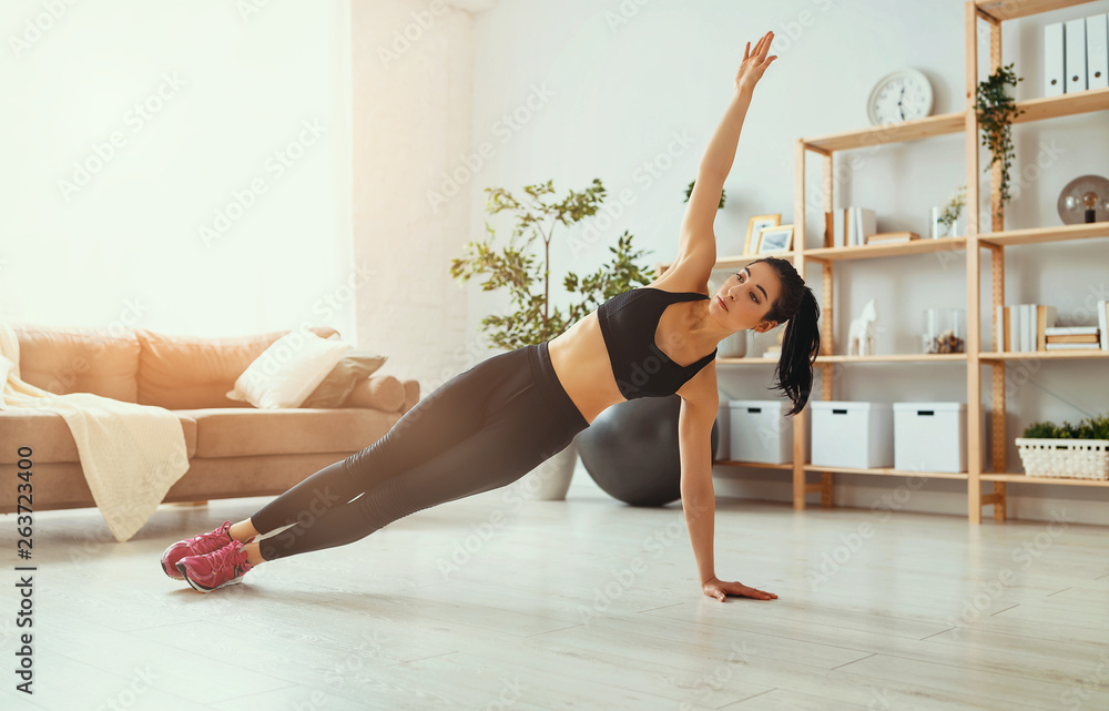 young woman doing fitness and sports at home . young woman doing fitness and sports at home .