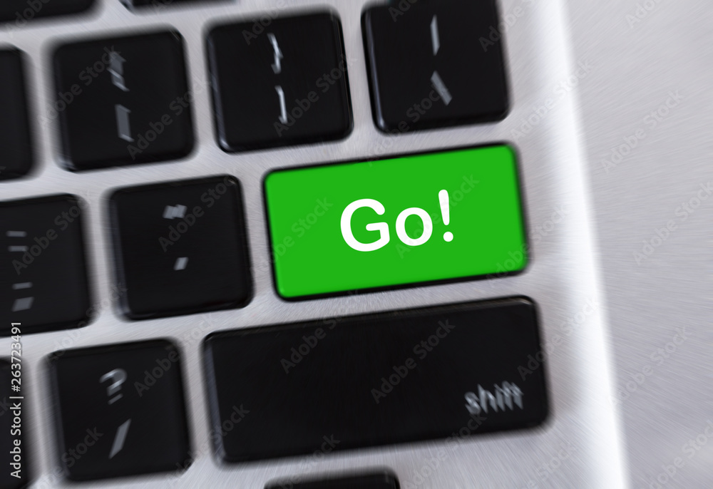 Word Go! written on green computer button Word Go! written on green computer button