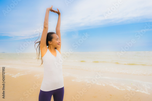 Portrait beautiful young sport asian woman exercise by run and jogging on the outdoor nature beach and sea