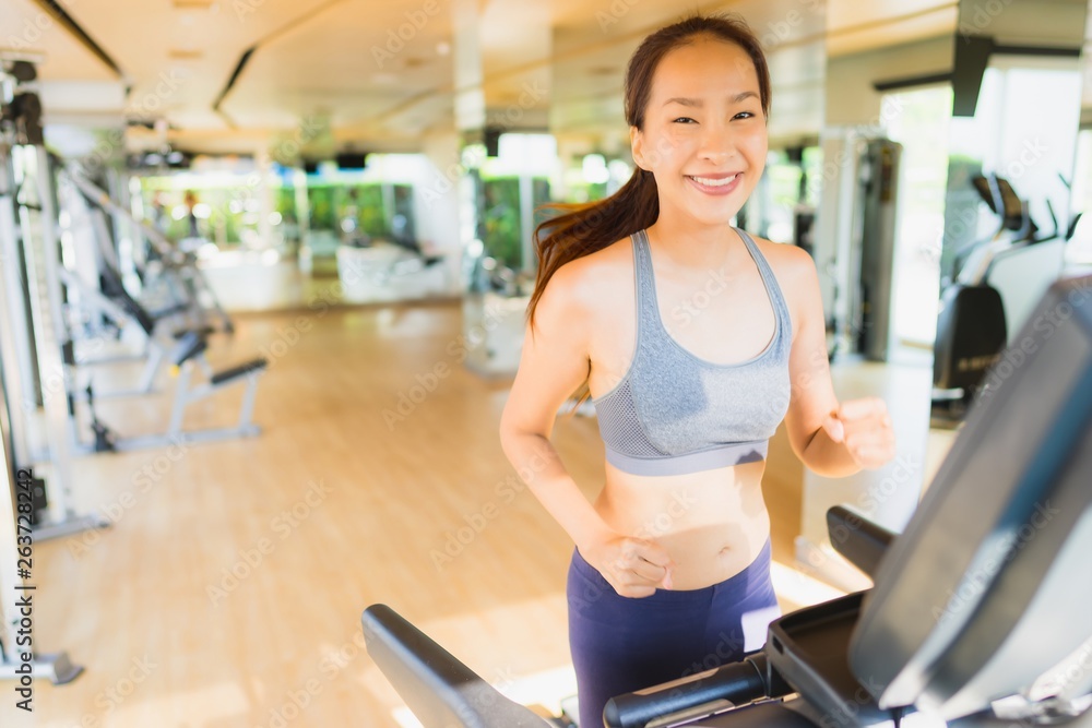 Obraz premium Portrait asian woman exercising and workout by running in gym
