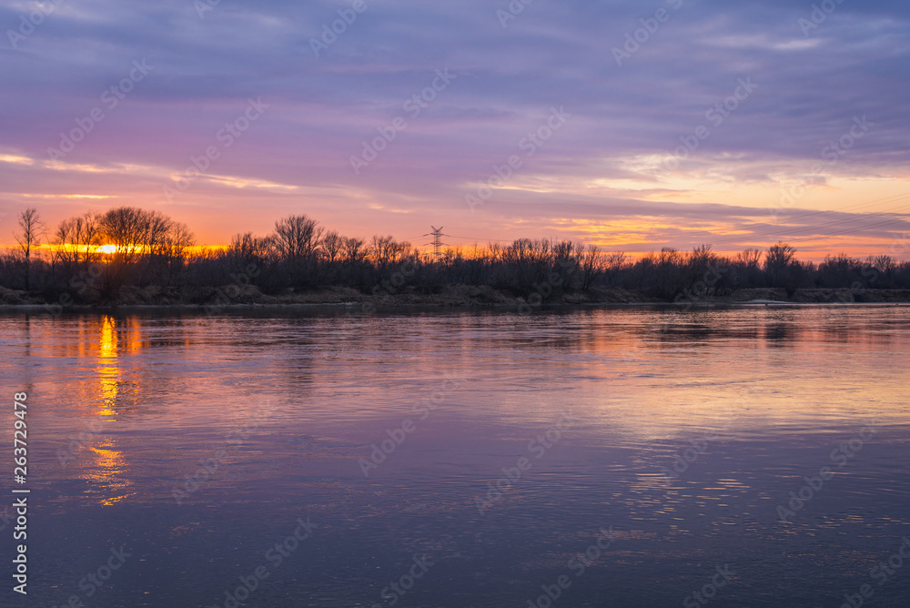 Evening sky above Vistula River seen from a bank in Wasaw, Poland Evening sky above Vistula River seen from a bank in Wasaw, Poland