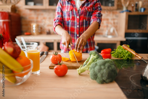 Black woman cooking healthy breakfast on kitchen