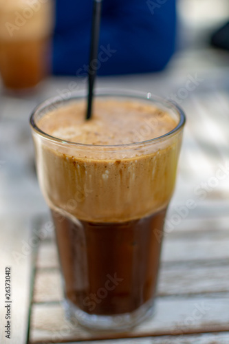 Traditional greek cold coffee Frappe made from water, instant coffee and ice cubes