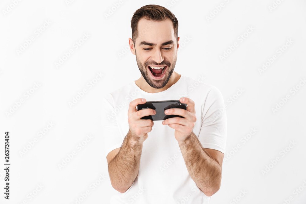 Handsome cheerful man wearing blank t-shirt Handsome cheerful man wearing blank t-shirt