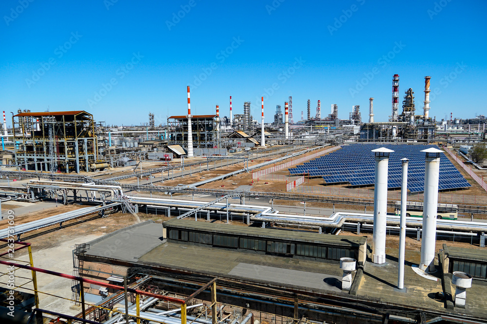 Installation of solar panels at and Oil refinery in Russia. equipment and complexes for hydrocarbon processing. Installation of solar panels at and Oil refinery in Russia. equipment and complexes for hydrocarbon processing.