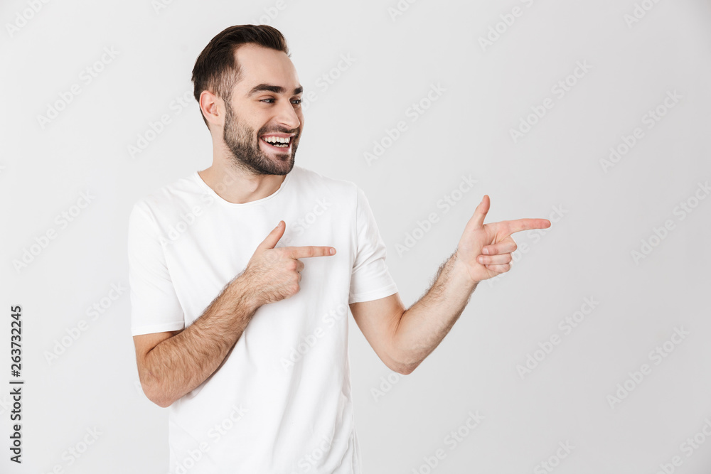 Handsome cheerful man wearing blank t-shirt Handsome cheerful man wearing blank t-shirt