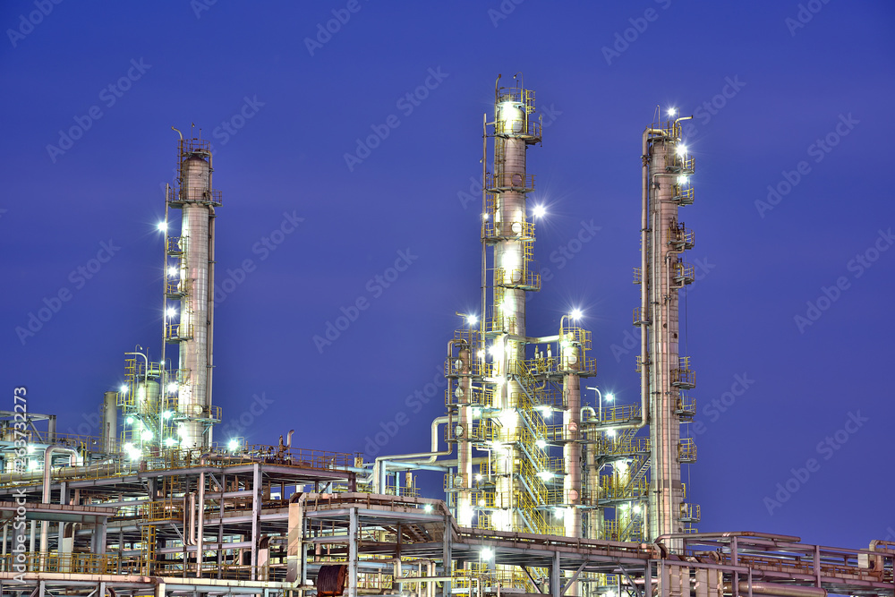 Close-up of pipelines and destillation tanks of an oil-refinery plant