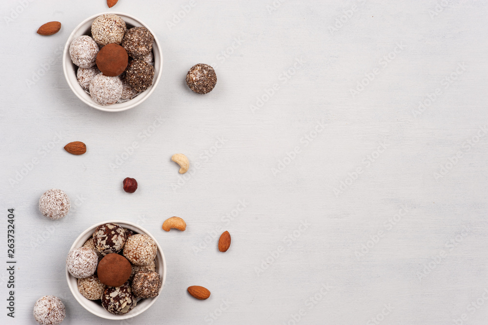 Energy balls in two bowls on the white background. Energy balls in two bowls on the white background.