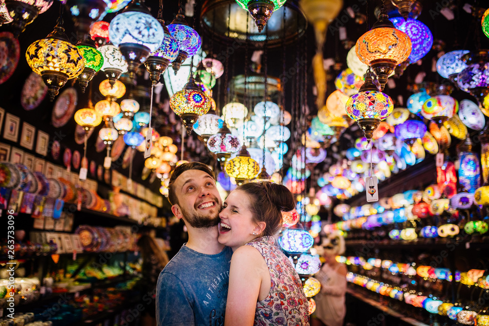 Fototapeta premium Couple embracing each other under turkish lights